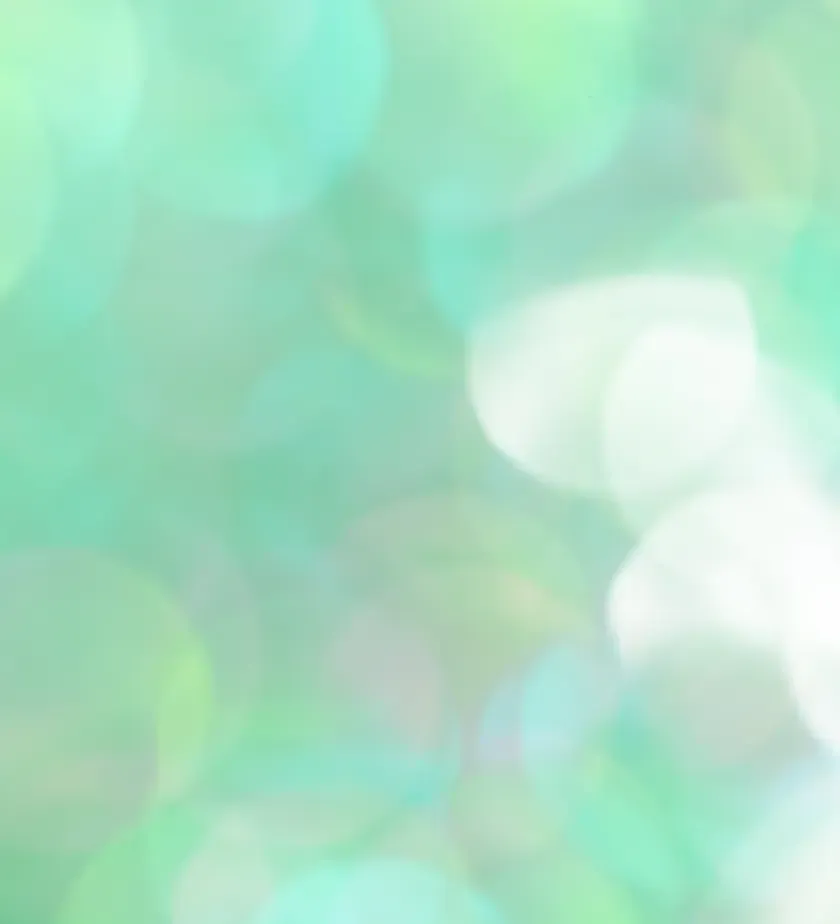 Halos de lumière vert menthe en flou d'arrière-plan