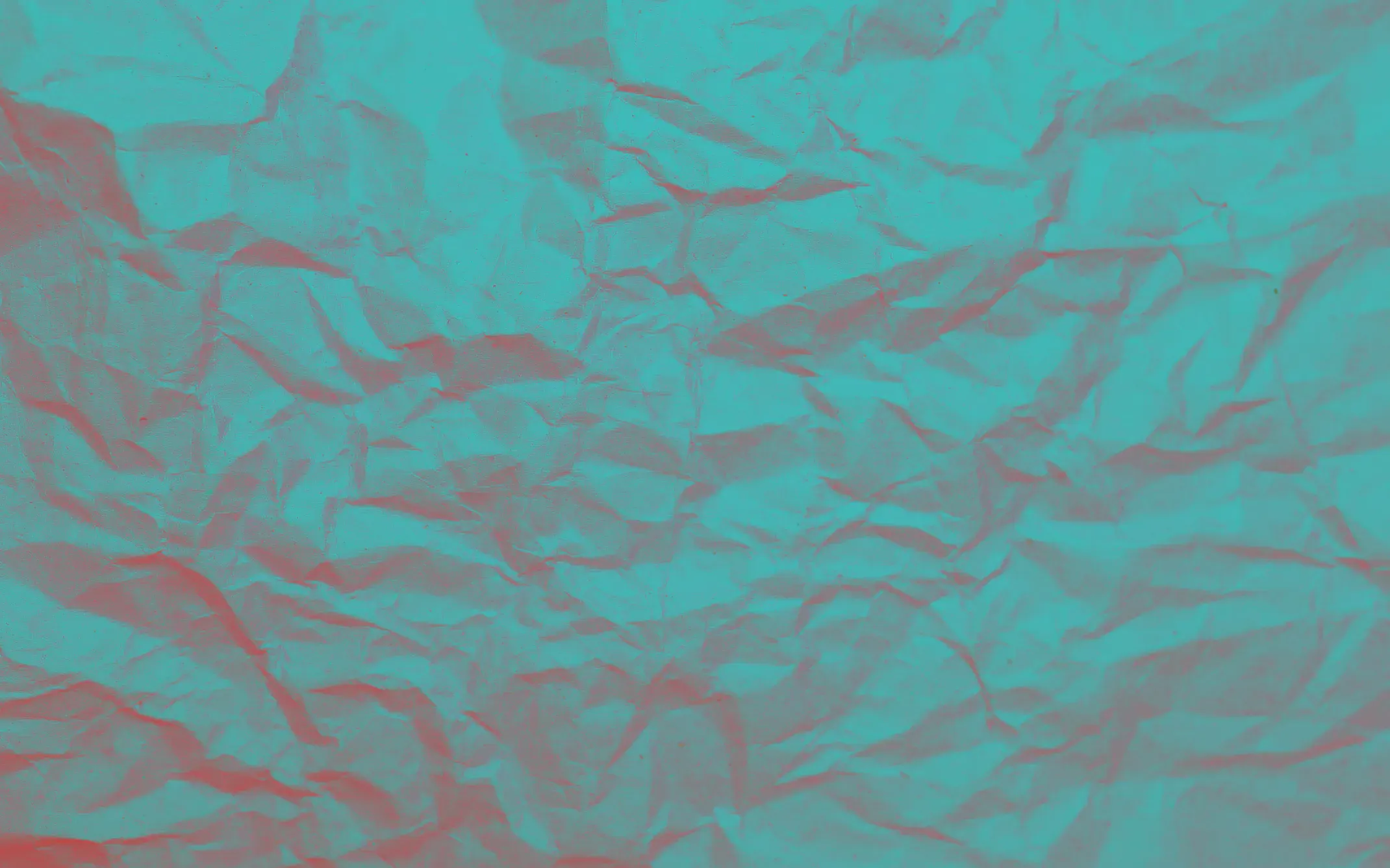 Papier froissé turquoise aux plis rehaussés de corail